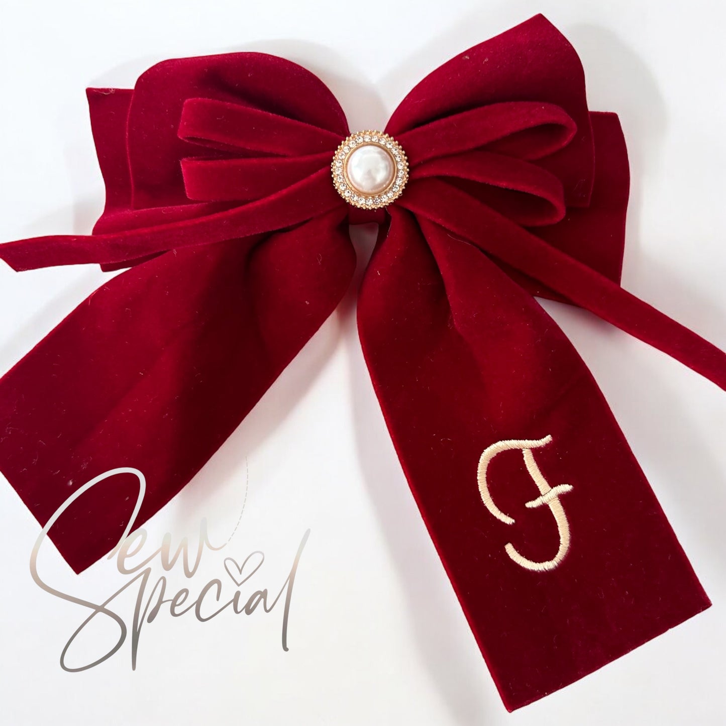 Deep red personalised Christmas hair bow with pearl detail