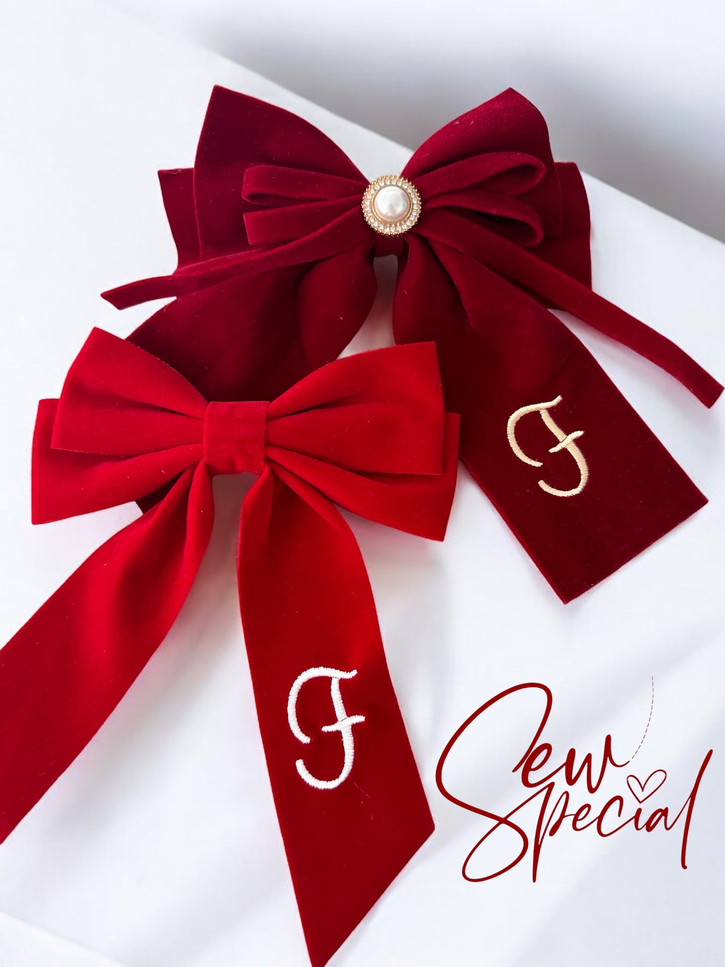 Deep red personalised Christmas hair bow with pearl detail