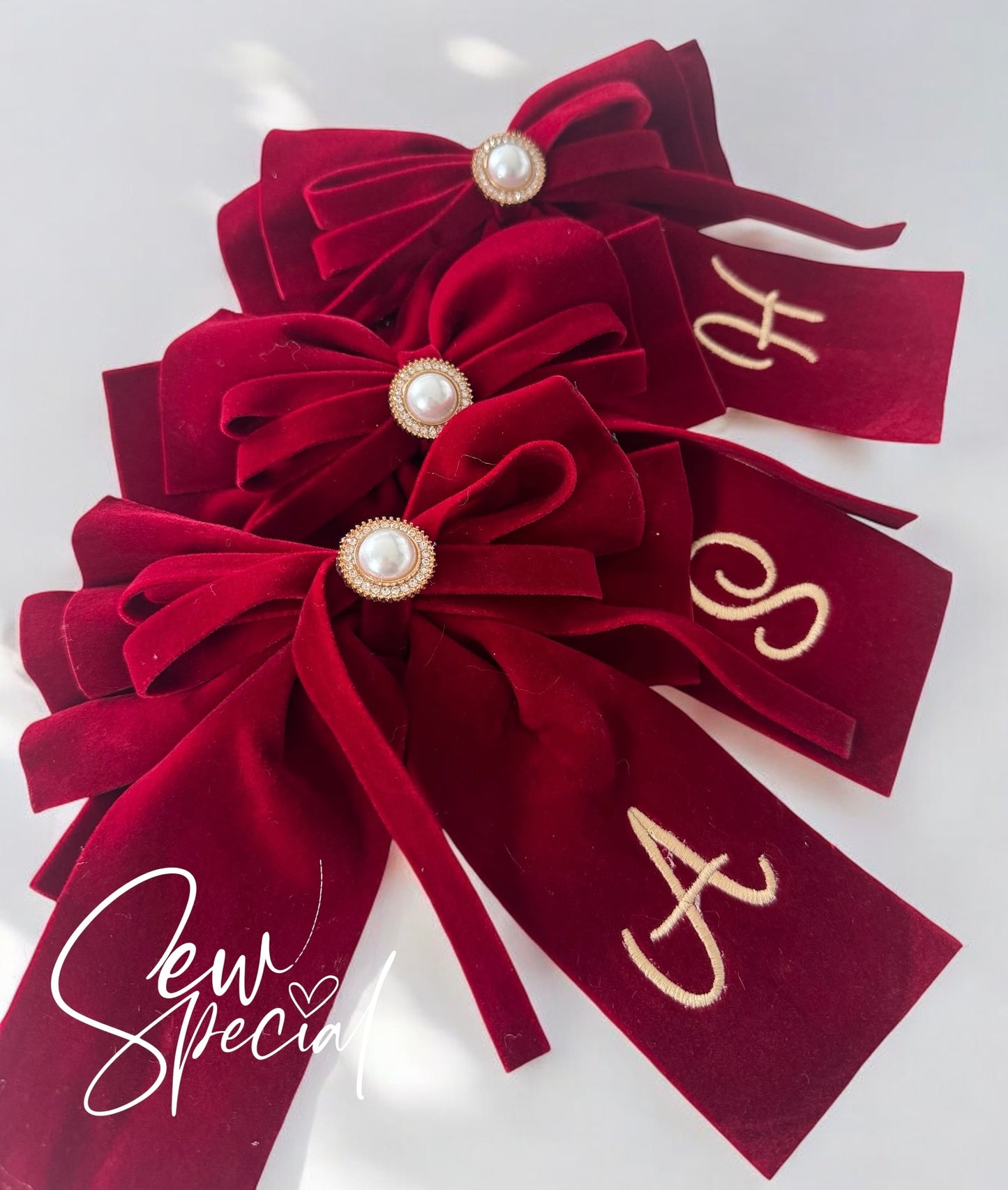 Deep red personalised Christmas hair bow with pearl detail